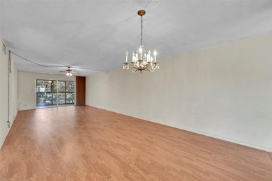 Deluxe Spacious Corner, Screened & Enclosed Balcony with Lake & on Wynmoor Golf Course in Florida - for sale on GolfHomes.com, golf home, golf lot