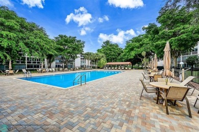 Deluxe Spacious Corner, Screened  Enclosed Balcony with Lake on Wynmoor Golf Course in Florida - for sale on GolfHomes.com, golf home, golf lot