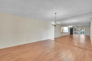 Deluxe Spacious Corner, Screened & Enclosed Balcony with Lake & on Wynmoor Golf Course in Florida - for sale on GolfHomes.com, golf home, golf lot