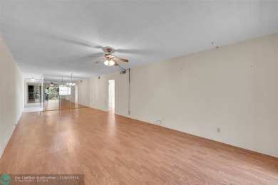 Deluxe Spacious Corner, Screened  Enclosed Balcony with Lake on Wynmoor Golf Course in Florida - for sale on GolfHomes.com, golf home, golf lot