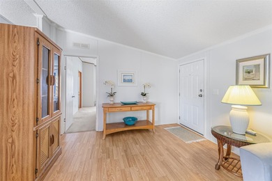 Enjoy easy coastal living in this fully furnished 3-bedroom on Barefoot Bay Golf Course in Florida - for sale on GolfHomes.com, golf home, golf lot