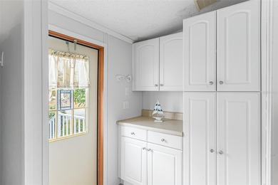 Enjoy easy coastal living in this fully furnished 3-bedroom on Barefoot Bay Golf Course in Florida - for sale on GolfHomes.com, golf home, golf lot