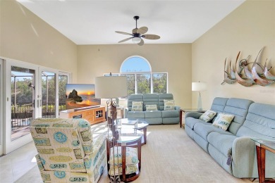 This stunning 4-bedroom home, located on the tranquil Bay Isles on Longboat Key Golf Club in Florida - for sale on GolfHomes.com, golf home, golf lot