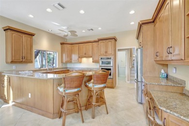 This stunning 4-bedroom home, located on the tranquil Bay Isles on Longboat Key Golf Club in Florida - for sale on GolfHomes.com, golf home, golf lot