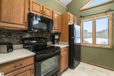 Experience the best of resort living in this fully furnished on Schuss Mountain Golf Club in Michigan - for sale on GolfHomes.com, golf home, golf lot
