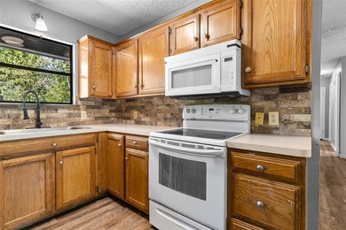 Charming Corner Lot nestled in the serene, gated community of on Holly Lake Ranch Golf Club in Texas - for sale on GolfHomes.com, golf home, golf lot