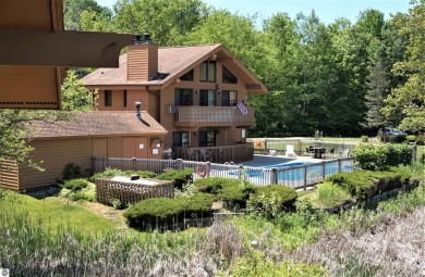 Experience the best of resort living in this fully furnished on Schuss Mountain Golf Club in Michigan - for sale on GolfHomes.com, golf home, golf lot