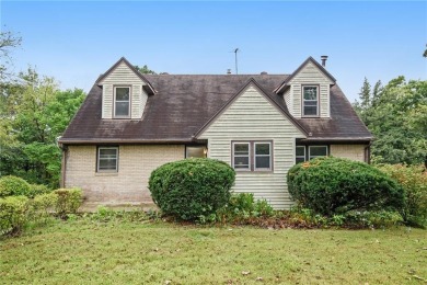This private and secluded two story home sits on a huge, treed on Loch Lloyd Country Club in Missouri - for sale on GolfHomes.com, golf home, golf lot