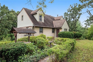 This private and secluded two story home sits on a huge, treed on Loch Lloyd Country Club in Missouri - for sale on GolfHomes.com, golf home, golf lot