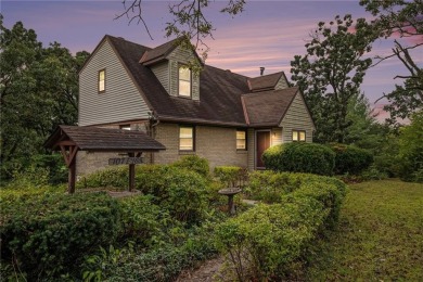 This private and secluded two story home sits on a huge, treed on Loch Lloyd Country Club in Missouri - for sale on GolfHomes.com, golf home, golf lot