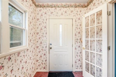 This private and secluded two story home sits on a huge, treed on Loch Lloyd Country Club in Missouri - for sale on GolfHomes.com, golf home, golf lot