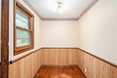 This private and secluded two story home sits on a huge, treed on Loch Lloyd Country Club in Missouri - for sale on GolfHomes.com, golf home, golf lot