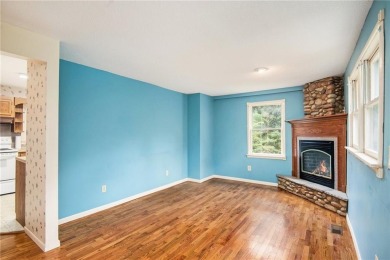 This private and secluded two story home sits on a huge, treed on Loch Lloyd Country Club in Missouri - for sale on GolfHomes.com, golf home, golf lot