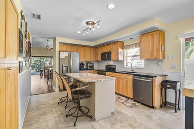 Start the new year in this beautifully maintained 2BR/2BA plus on Peridia Golf and Country Club in Florida - for sale on GolfHomes.com, golf home, golf lot