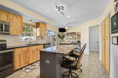 Start the new year in this beautifully maintained 2BR/2BA plus on Peridia Golf and Country Club in Florida - for sale on GolfHomes.com, golf home, golf lot