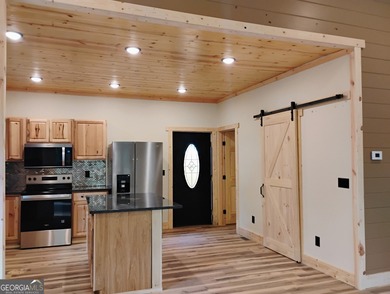 Contemporary Rustic Retreat in Coosawattee River Resort, Welcome on White Path Golf Club in Georgia - for sale on GolfHomes.com, golf home, golf lot