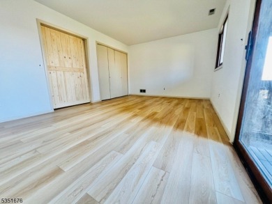 Step into this freshly renovated 2-bed, 2-bath end-unit on a on Minerals Golf Club in New Jersey - for sale on GolfHomes.com, golf home, golf lot