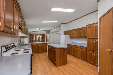 Love the peaceful lakeside living and exciting recreational on Linn Valley Lakes - Deer Trace Golf Course in Kansas - for sale on GolfHomes.com, golf home, golf lot