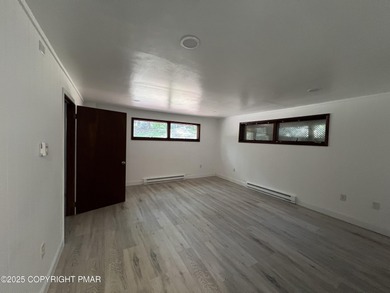 Located among a golf course, fishing spots and pools, tennis on Pocono Farms Country Club in Pennsylvania - for sale on GolfHomes.com, golf home, golf lot