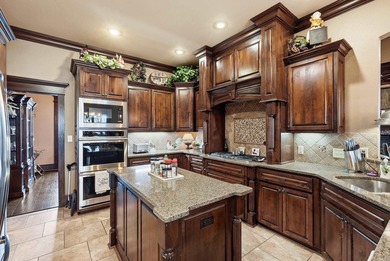 Welcome to this exceptional home overlooking the 14th hole at on Centennial Valley Golf Course in Arkansas - for sale on GolfHomes.com, golf home, golf lot