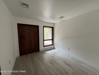 Located among a golf course, fishing spots and pools, tennis on Pocono Farms Country Club in Pennsylvania - for sale on GolfHomes.com, golf home, golf lot