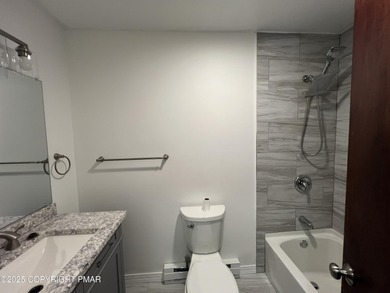 Located among a golf course, fishing spots and pools, tennis on Pocono Farms Country Club in Pennsylvania - for sale on GolfHomes.com, golf home, golf lot