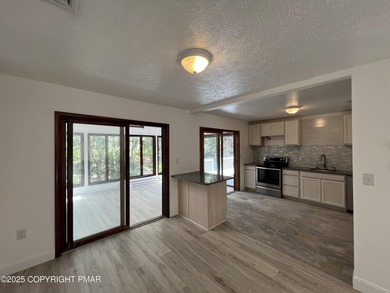 Located among a golf course, fishing spots and pools, tennis on Pocono Farms Country Club in Pennsylvania - for sale on GolfHomes.com, golf home, golf lot