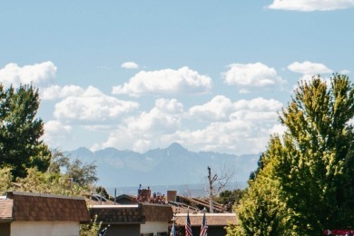 Beautiful Townhome with Mountain Views Bordering Black Canyon on Black Canyon Golf Club At Montrose in Colorado - for sale on GolfHomes.com, golf home, golf lot