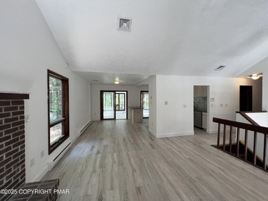 Located among a golf course, fishing spots and pools, tennis on Pocono Farms Country Club in Pennsylvania - for sale on GolfHomes.com, golf home, golf lot