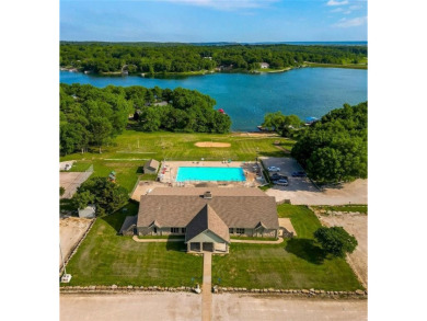 Love the peaceful lakeside living and exciting recreational on Linn Valley Lakes - Deer Trace Golf Course in Kansas - for sale on GolfHomes.com, golf home, golf lot