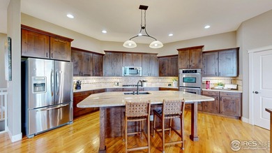 Nestled on a quiet cul de sac in coveted Highland Meadows Golf on Highland Meadows Golf Course in Colorado - for sale on GolfHomes.com, golf home, golf lot