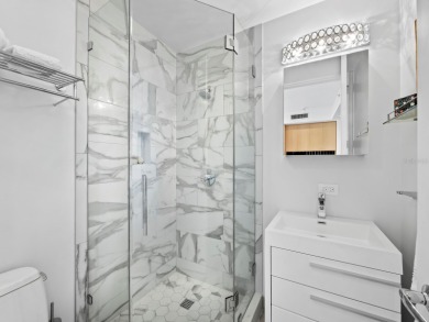 Beautifully renovated and offered turnkey furnished, this 3BR/3 on Longboat Key Golf Club Resort in Florida - for sale on GolfHomes.com, golf home, golf lot