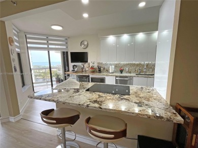 Experience luxury living with million-dollar views in this on Turnberry Isle Resort and Club in Florida - for sale on GolfHomes.com, golf home, golf lot