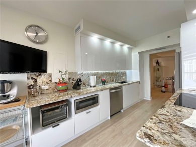 Experience luxury living with million-dollar views in this on Turnberry Isle Resort and Club in Florida - for sale on GolfHomes.com, golf home, golf lot