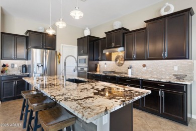 This stunning oasis is located on the 16th hole in Estrella's on Estrella Mountain Ranch Golf Course in Arizona - for sale on GolfHomes.com, golf home, golf lot