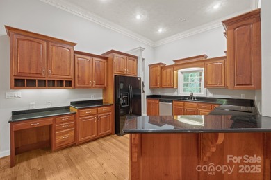 Spacious mostly brick home with main level living located in the on Granada Farms Country Club in North Carolina - for sale on GolfHomes.com, golf home, golf lot