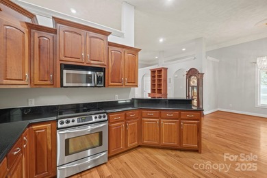 Spacious mostly brick home with main level living located in the on Granada Farms Country Club in North Carolina - for sale on GolfHomes.com, golf home, golf lot