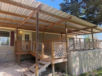 Discover the perfect waterfront getaway on Lake Fork! This on Links At Lands End in Texas - for sale on GolfHomes.com, golf home, golf lot