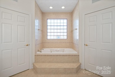 Spacious mostly brick home with main level living located in the on Granada Farms Country Club in North Carolina - for sale on GolfHomes.com, golf home, golf lot