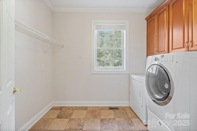 Spacious mostly brick home with main level living located in the on Granada Farms Country Club in North Carolina - for sale on GolfHomes.com, golf home, golf lot