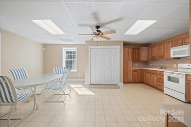 Spacious mostly brick home with main level living located in the on Granada Farms Country Club in North Carolina - for sale on GolfHomes.com, golf home, golf lot