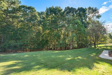 Spacious mostly brick home with main level living located in the on Granada Farms Country Club in North Carolina - for sale on GolfHomes.com, golf home, golf lot