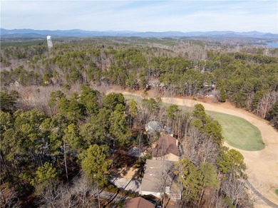 Set within the gates of Keowee Key, this well-appointed golf on Keowee Key Golf and Country Club in South Carolina - for sale on GolfHomes.com, golf home, golf lot