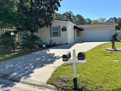 Welcome to this charming 3 bedroom, 2 bath Palm Harbor home on St. Johns Golf Club in Florida - for sale on GolfHomes.com, golf home, golf lot