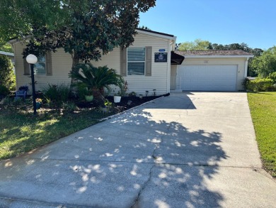 Welcome to this charming 3 bedroom, 2 bath Palm Harbor home on St. Johns Golf Club in Florida - for sale on GolfHomes.com, golf home, golf lot