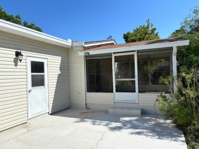 Welcome to this charming 3 bedroom, 2 bath Palm Harbor home on St. Johns Golf Club in Florida - for sale on GolfHomes.com, golf home, golf lot