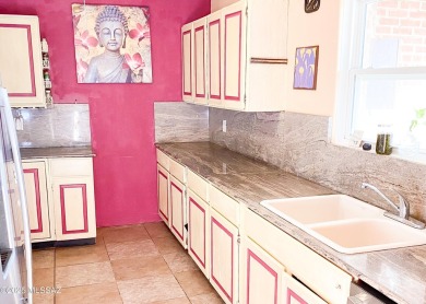 This charming solid brick home sits on a coveted 0.30-acre on Randolph Park Golf Courses in Arizona - for sale on GolfHomes.com, golf home, golf lot