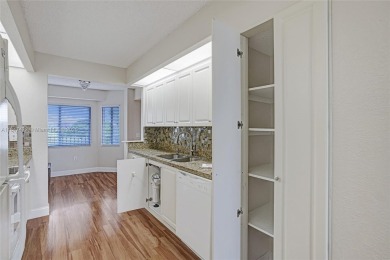 This substantially remodeled 2 bedroom with 2 baths is located on Flamingo Lakes Country Club in Florida - for sale on GolfHomes.com, golf home, golf lot