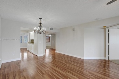 This substantially remodeled 2 bedroom with 2 baths is located on Flamingo Lakes Country Club in Florida - for sale on GolfHomes.com, golf home, golf lot
