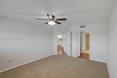 This substantially remodeled 2 bedroom with 2 baths is located on Flamingo Lakes Country Club in Florida - for sale on GolfHomes.com, golf home, golf lot